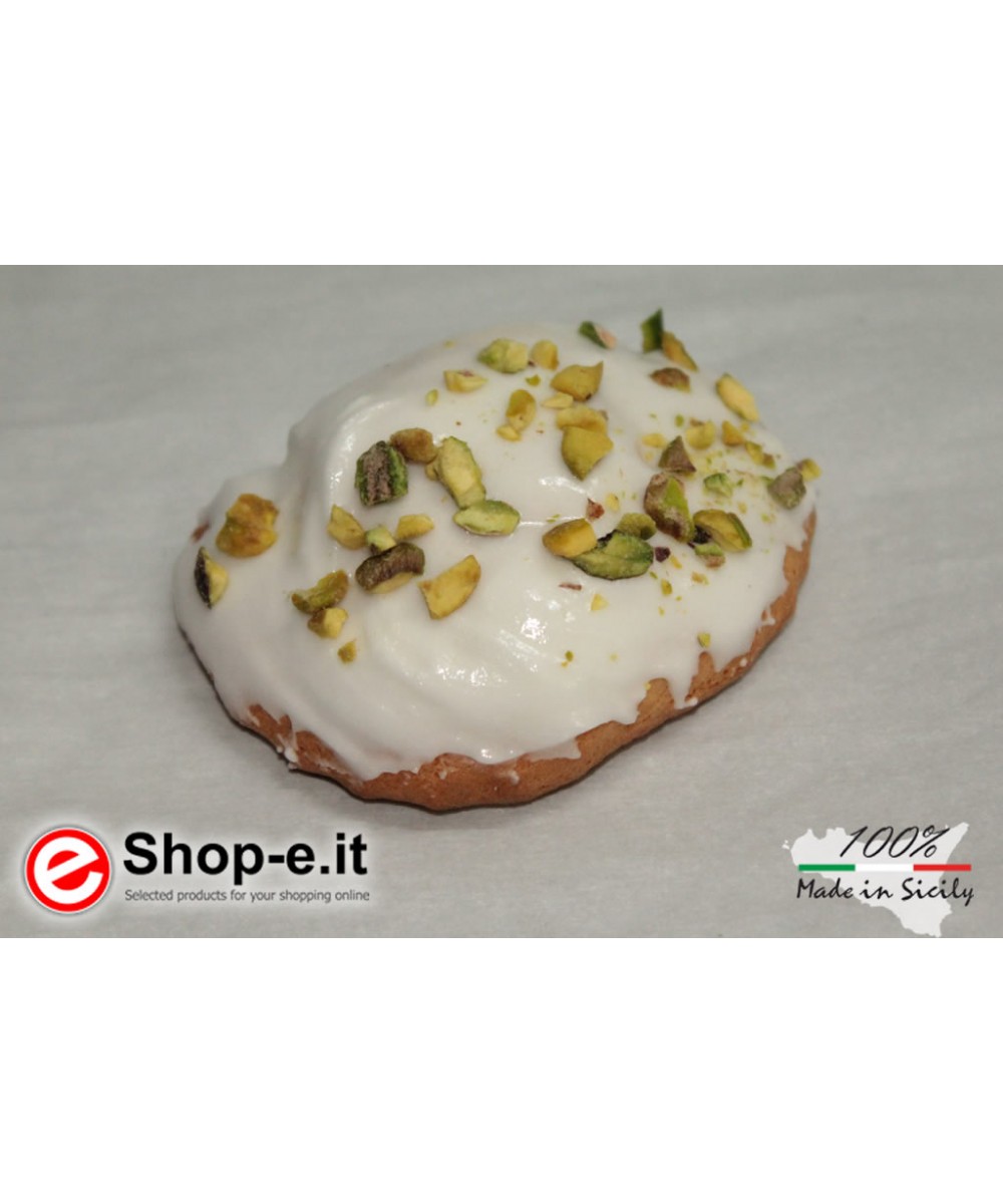 Buccellati with Sicilian almonds covered with icing and pistachio grains